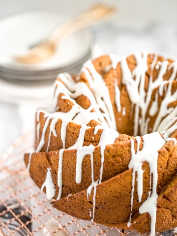 Celebrate fall this year with think and dense, yet surprisingly light, pumpkin pie bundt cake with cream cheese glaze. Can you think of a more perfect pair? | aheadofthyme.com