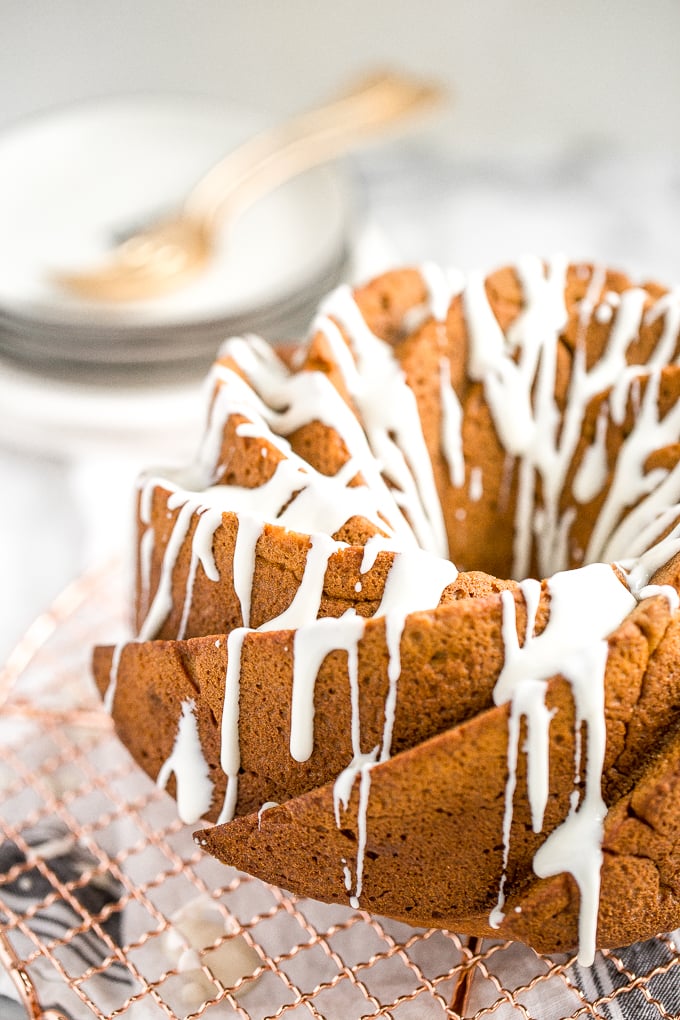 Celebrate fall this year with think and dense, yet surprisingly light, pumpkin pie bundt cake with cream cheese glaze. Can you think of a more perfect pair? | aheadofthyme.com