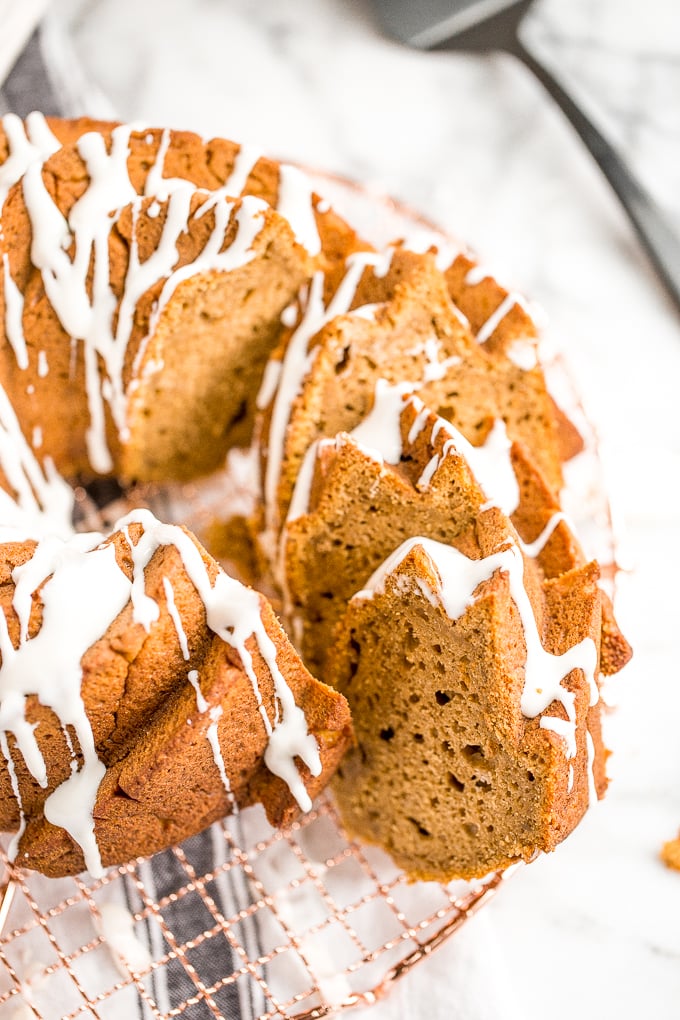 Celebrate fall this year with think and dense, yet surprisingly light, pumpkin pie bundt cake with cream cheese glaze. Can you think of a more perfect pair? | aheadofthyme.com