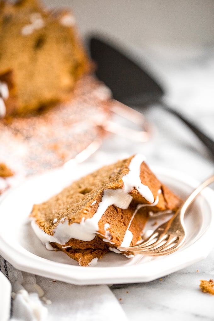 Celebrate fall this year with think and dense, yet surprisingly light, pumpkin pie bundt cake with cream cheese glaze. Can you think of a more perfect pair? | aheadofthyme.com