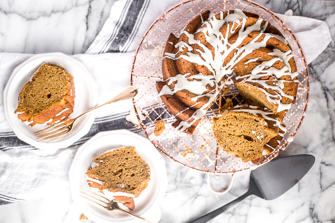 Celebrate fall this year with think and dense, yet surprisingly light, pumpkin pie bundt cake with cream cheese glaze. Can you think of a more perfect pair? | aheadofthyme.com