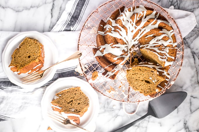 Celebrate fall this year with think and dense, yet surprisingly light, pumpkin pie bundt cake with cream cheese glaze. Can you think of a more perfect pair? | aheadofthyme.com