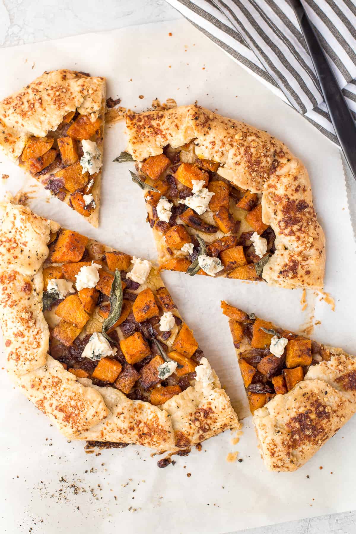 This butternut squash galette (free-form tart) is the perfect meal any time of day! Serve it with a fried egg for breakfast or alongside a big salad for lunch or dinner. | aheadofthyme.com