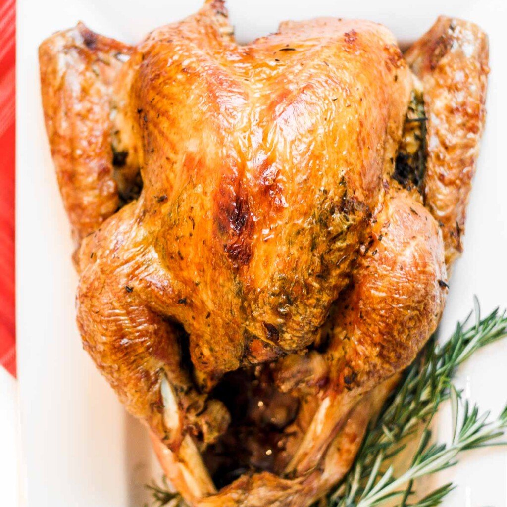 Make the best juicy roast turkey with this easy recipe! Learn how to roast a turkey perfectly golden, tender, and flavorful every time. | aheadofthyme.com
