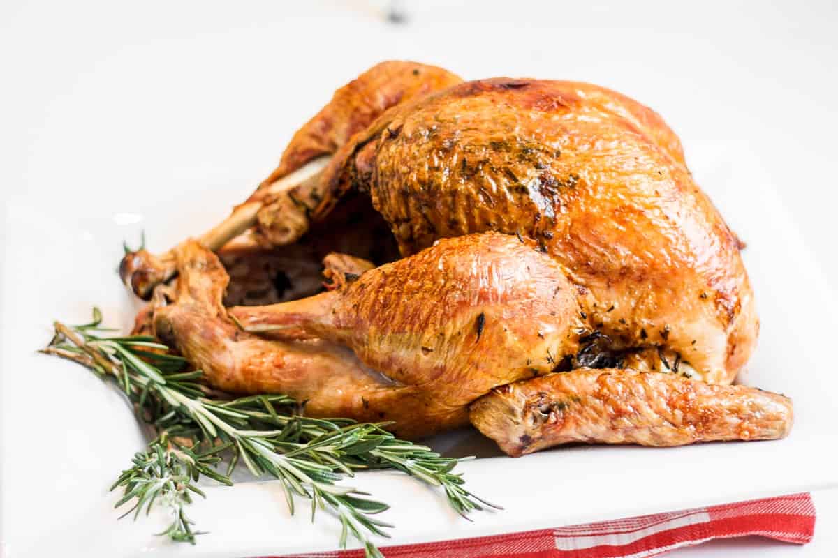 Make the best juicy roast turkey with this easy recipe! Learn how to roast a turkey perfectly golden, tender, and flavorful every time. | aheadofthyme.com