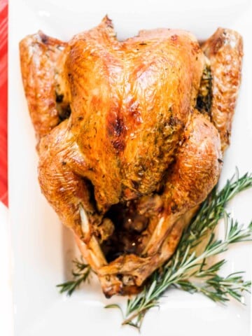 Make the best juicy roast turkey with this easy recipe! Learn how to roast a turkey perfectly golden, tender, and flavorful every time. | aheadofthyme.com