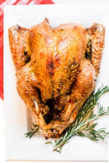 Make the best juicy roast turkey with this easy recipe! Learn how to roast a turkey perfectly golden, tender, and flavorful every time. | aheadofthyme.com