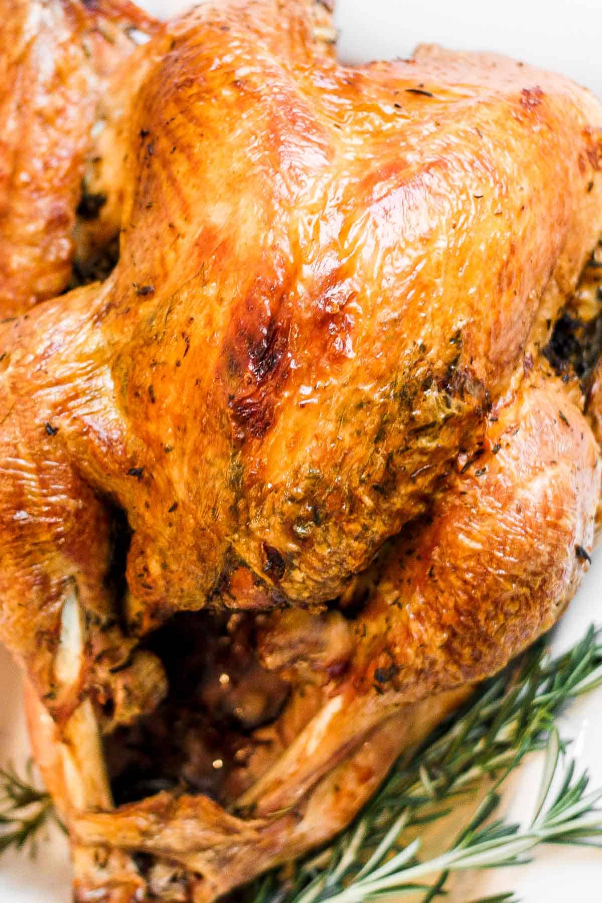 Make the best juicy roast turkey with this easy recipe! Learn how to roast a turkey perfectly golden, tender, and flavorful every time. | aheadofthyme.com