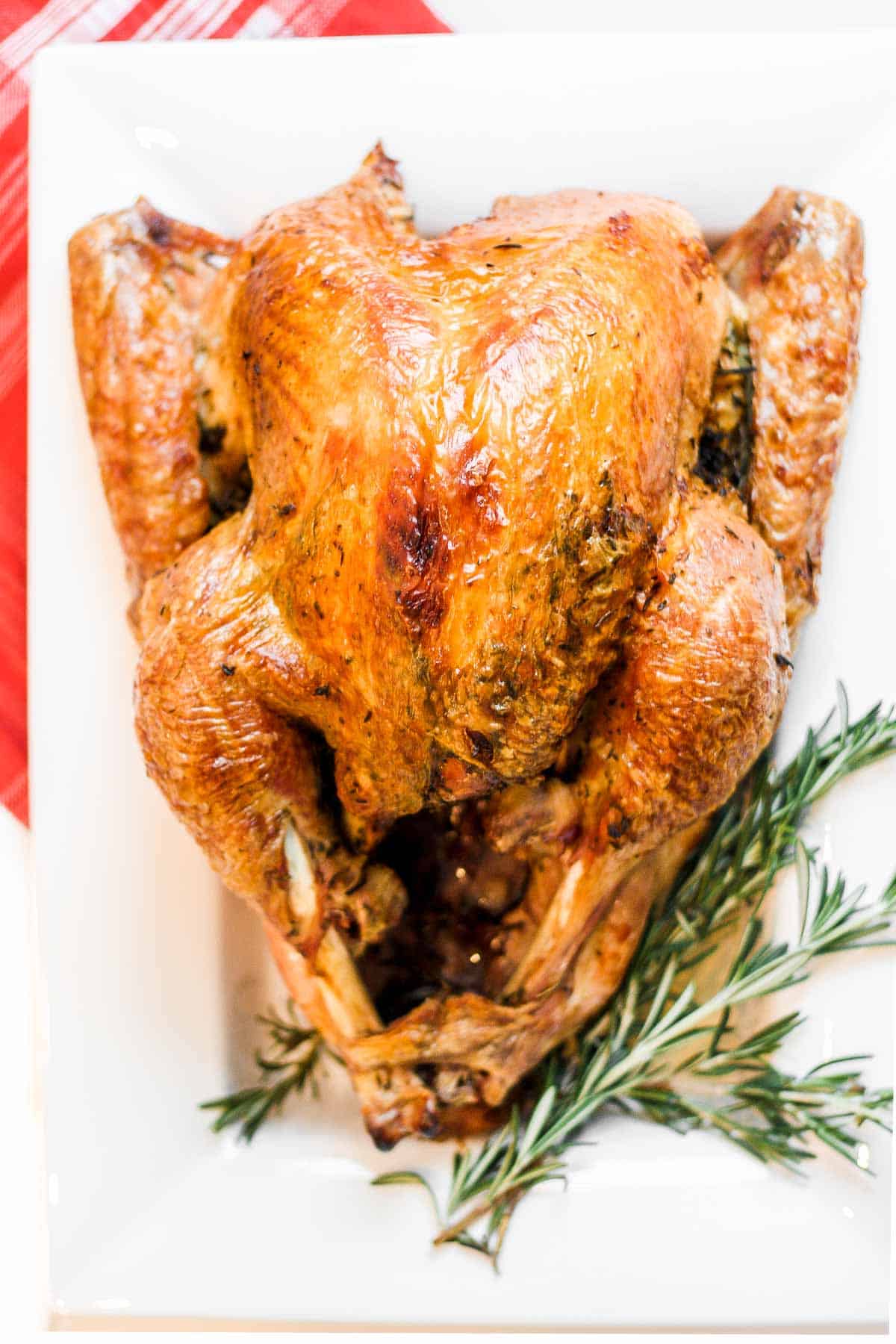 Make the best juicy roast turkey with this easy recipe! Learn how to roast a turkey perfectly golden, tender, and flavorful every time. | aheadofthyme.com