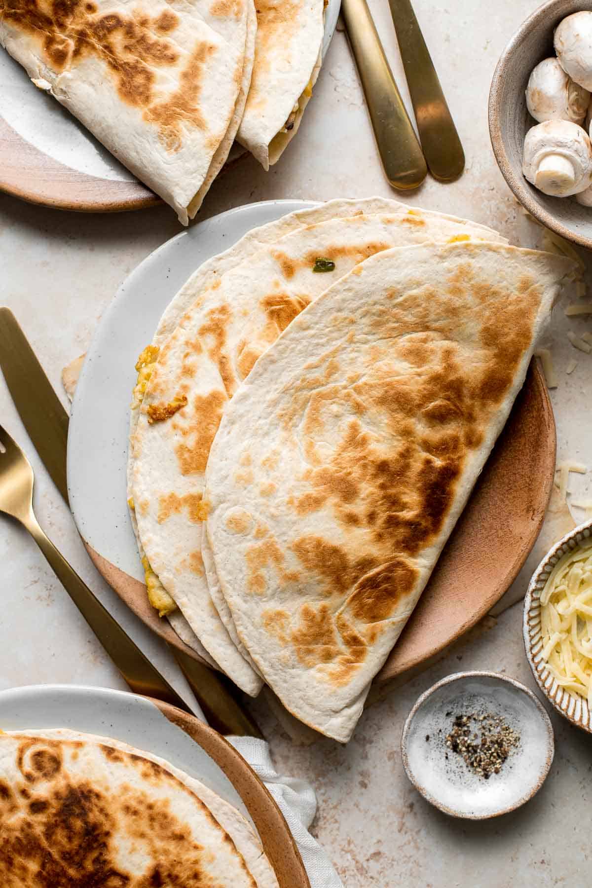 Vegetarian Breakfast Quesadillas are quick and easy to make, loaded with eggs and veggies, and flavorful. Perfect for meal prep and freezer-friendly too. | aheadofthyme.com