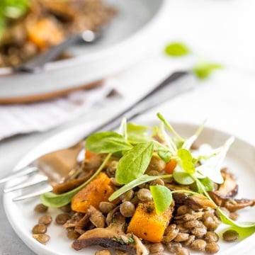 This warm lentil salad with butternut squash and shiitake mushrooms is the most comforting vegetarian main! Completely satisfying on its own or served with roasted chicken or salmon. | aheadofthyme.com