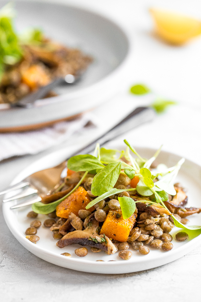 This warm lentil salad with butternut squash and shiitake mushrooms is the most comforting vegetarian main! Completely satisfying on its own or served with roasted chicken or salmon. | aheadofthyme.com