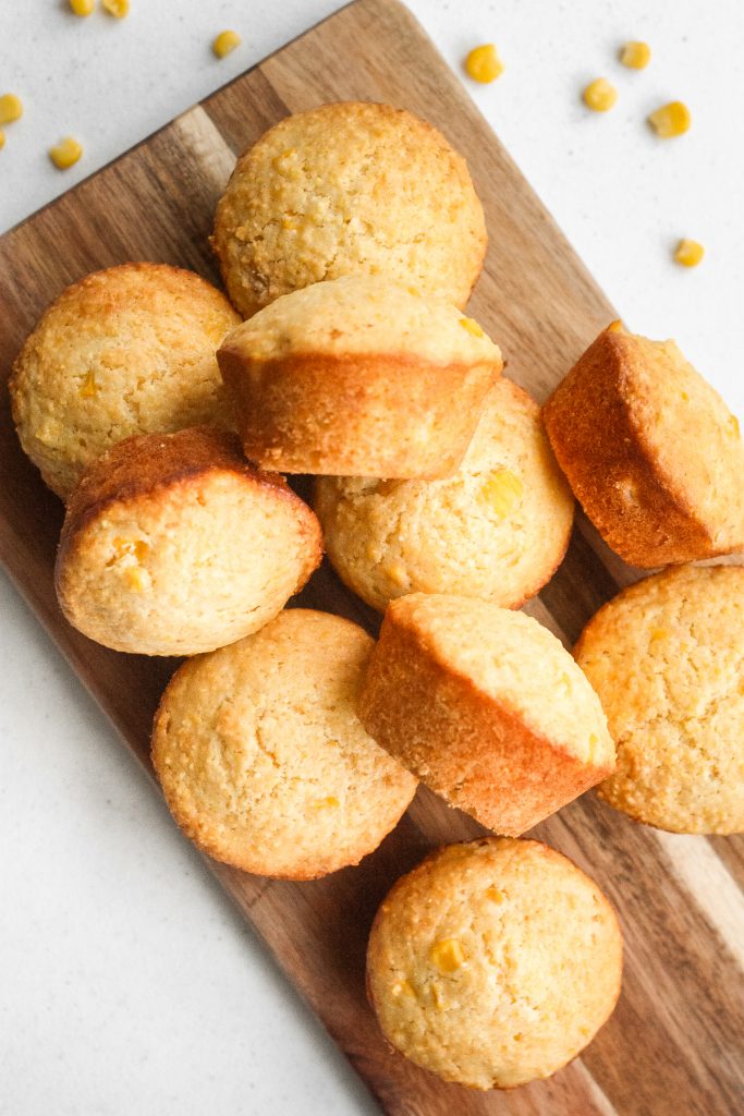 Easy cornbread muffins just made cooking a whole lot easier and tastier! These moist and fluffy muffins are made with cornmeal, cooked corn kernels, and sweetened with honey for a burst of flavor in every bite. | aheadofthyme.com
