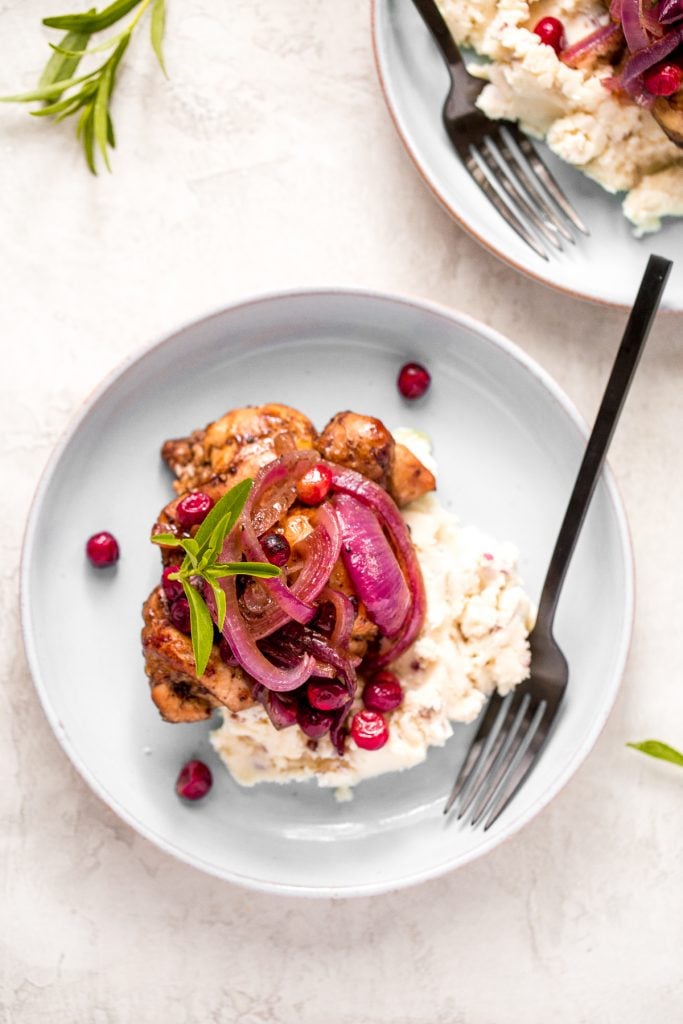 Roasted balsamic chicken with cranberries is a quick and easy 30-minute weeknight dinner made with tender chicken thighs in a sweet and tangy marinade. | aheadofthyme.com