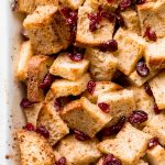 Festive baked gingerbread french toast casserole with cranberries is soft on the inside and crispy outside. The best holiday breakfast on Christmas morning. | aheadofthyme.com