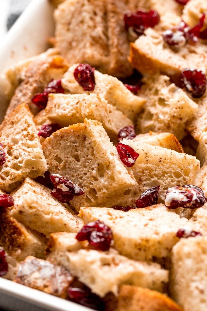 Festive baked gingerbread french toast casserole with cranberries is soft on the inside and crispy outside. The best holiday breakfast on Christmas morning. | aheadofthyme.com