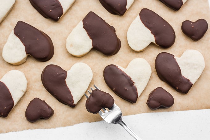 Celebrate love this Valentine's Day with adorable chocolate-dipped shortbread heart cookies for your hunny. Try and just have one! | aheadofthyme.com