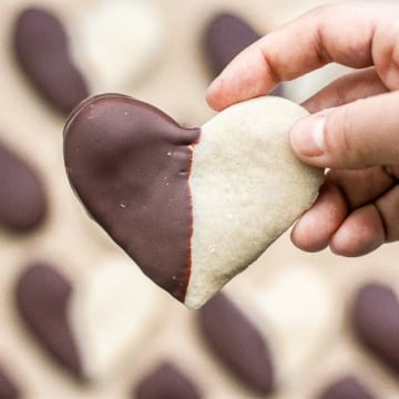 Celebrate love this Valentine's Day with adorable chocolate-dipped shortbread heart cookies for your hunny. Try and just have one! | aheadofthyme.com