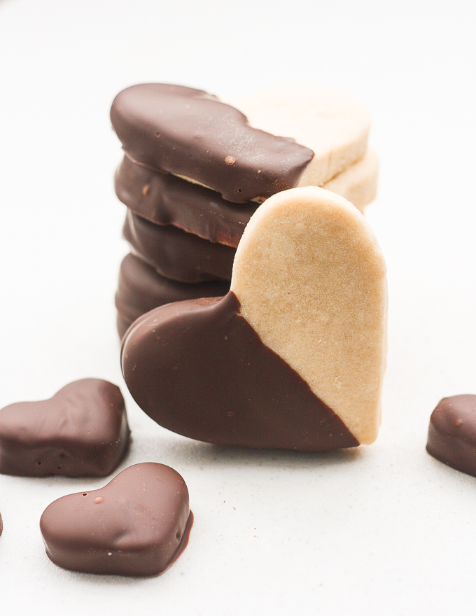 Celebrate love this Valentine's Day with adorable chocolate-dipped shortbread heart cookies for your hunny. Try and just have one! | aheadofthyme.com