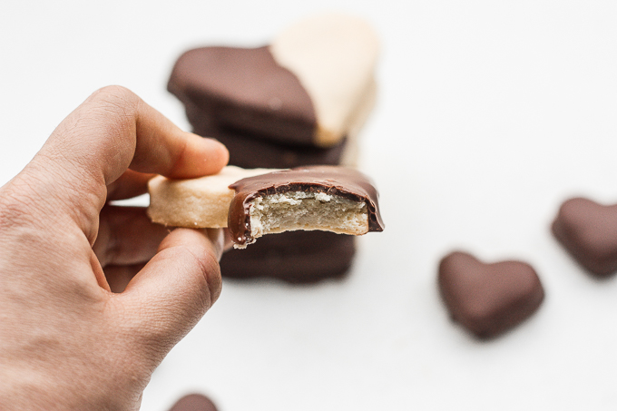Celebrate love this Valentine's Day with adorable chocolate-dipped shortbread heart cookies for your hunny. Try and just have one! | aheadofthyme.com