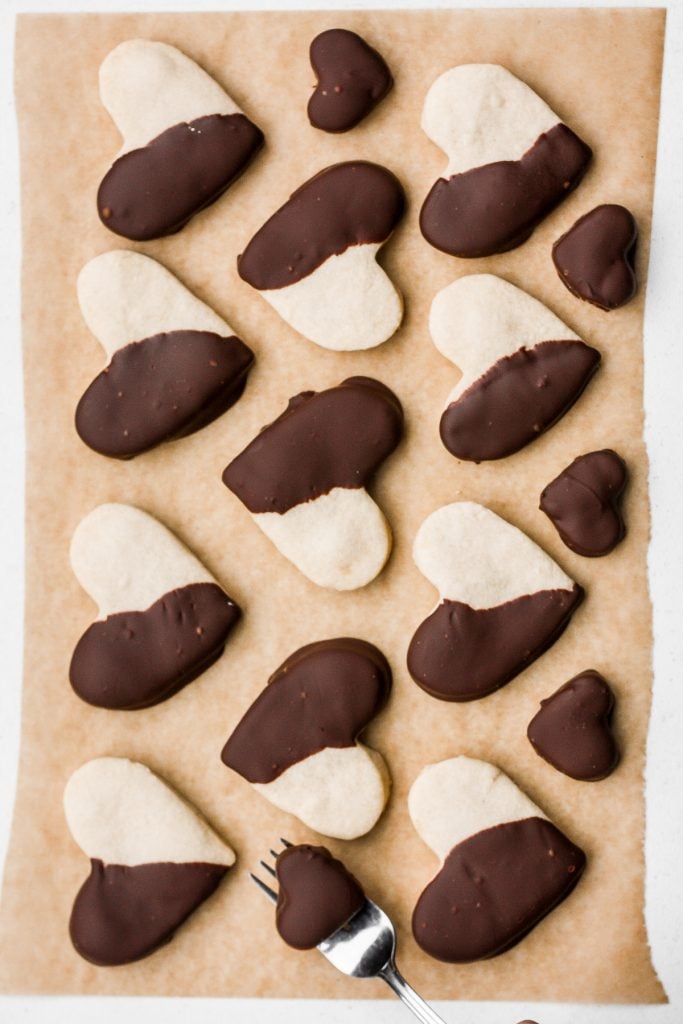 Celebrate love this Valentine's Day with adorable chocolate-dipped shortbread heart cookies for your hunny. Try and just have one. | aheadofthyme.com