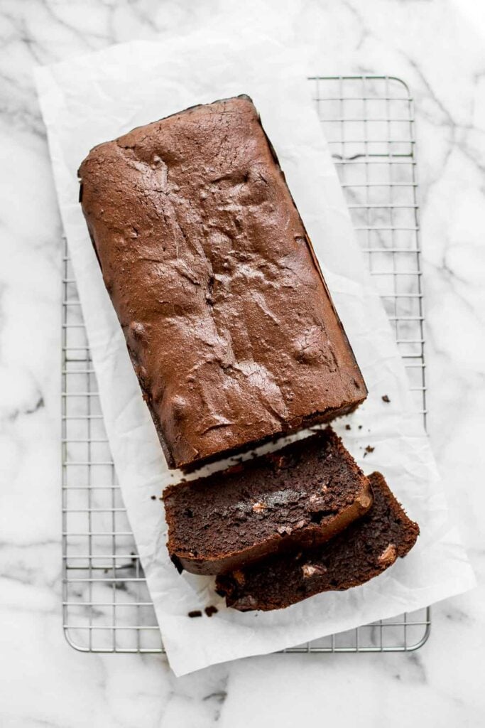 This fudgy double chocolate loaf cake is delicious, moist, and rich. It's easy to make with a quick one-bowl batter that's ready for the oven in 10 minutes. | aheadofthyme.com