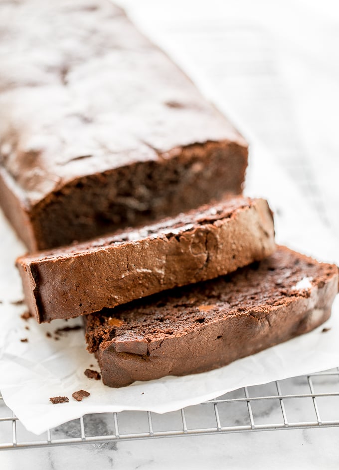 Double chocolate loaf cake is rich, intensely flavored, and a total show stopper this Valentine's Day. It is dense and chewy, but it tastes like fudge! | aheadofthyme.com