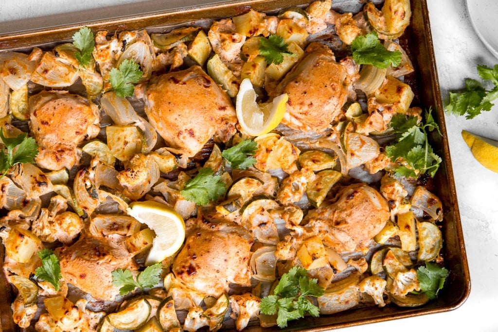 In under 30 minutes, create intensely flavourful tandoori chicken sheet pan dinner loaded with vegetables, any night of the week! Good-bye takeout! | aheadofthyme.com