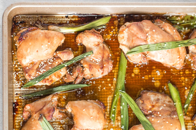 Sheet pan soy-glazed chicken thighs is the perfect weeknight meal -- 30 minutes in the marinade and 20 minutes in the oven. Easier and healthier than take-out! | aheadofthyme.com
