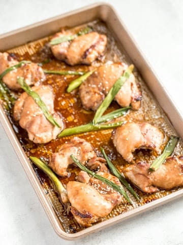 Sheet pan soy-glazed chicken thighs is the perfect weeknight meal -- 30 minutes in the marinade and 20 minutes in the oven. Easier and healthier than take-out! | aheadofthyme.com