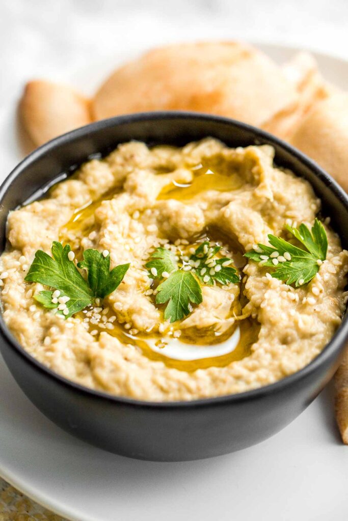 Baba ganoush eggplant dip is a delicious, flavorful, and vegan Mediterranean dip, loaded with roasted eggplants, olive oil, tahini, lemon, and garlic. | aheadofthyme.com