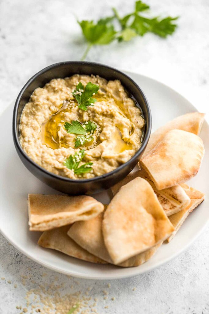 Baba ganoush eggplant dip is a delicious, flavorful, and vegan Mediterranean dip, loaded with roasted eggplants, olive oil, tahini, lemon, and garlic. | aheadofthyme.com