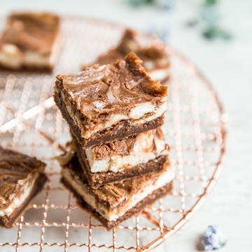 Caramel cheesecake brownies are totally indulgent and worth the effort, so toss that prepared brownie mix away and bake this with a few easy ingredients! | aheadofthyme.com