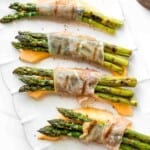 Prosciutto wrapped asparagus and melon are salty, sweet, and juicy. They are easy to make with a handful of simple ingredients, then cooked on the grill. | aheadofthyme.com