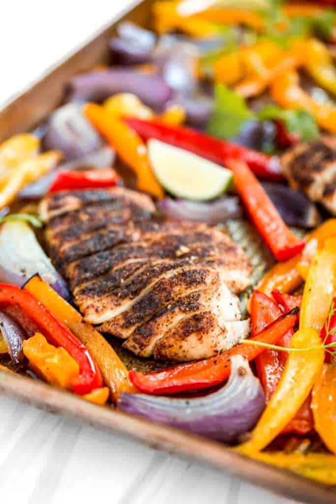 Sheet pan chicken fajitas are quick and easy to make, loaded with flavor, delicious, and ready in less than 30 minutes. Great for meal prep too. | aheadofthyme.com