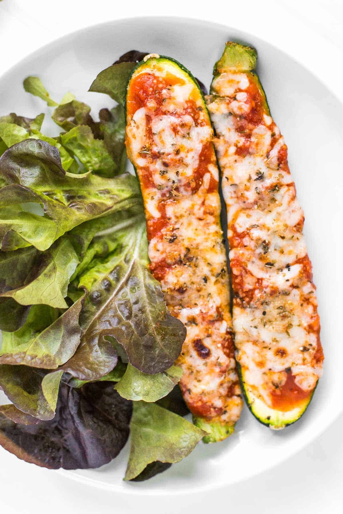 Cheesy Baked Zucchini with Marinara will save your weeknight dinner routine (and the kids love it too!). It's low carb, vegetarian, gluten-free, and keto. | aheadofthyme.com