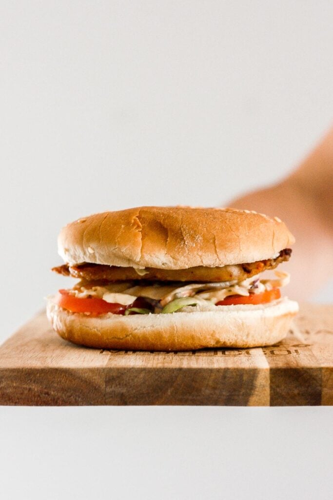 These 15-minute fish burgers with creamy slaw are juicy, flakey, and packed with flavour. So easy that it's the perfect summer weeknight meal! | aheadofthyme.com