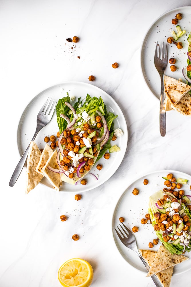 Mediterranean chickpea wedge salad combines chickpeas, crunchy vegetable toppings, and hummus dressing for a delicious deconstructed falafel flavour. | aheadofthyme.com