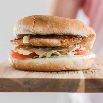 This 15-minute fish burgers with creamy slaw is juicy, flakey, and packed with flavour. So easy that it's the perfect summer weeknight meal! | aheadofthyme.com