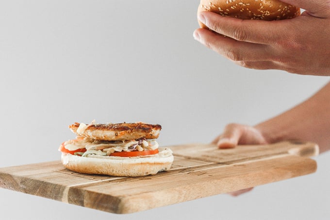 This 15-minute fish burgers with creamy slaw is juicy, flakey, and packed with flavour. So easy that it's the perfect summer weeknight meal! | aheadofthyme.com