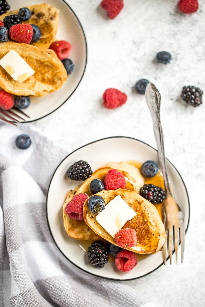 Breakfast routine in need of a shake up? This triple berry french toast with an overload of berries and maple syrup drizzled on top, is just what you need! | aheadofthyme.com