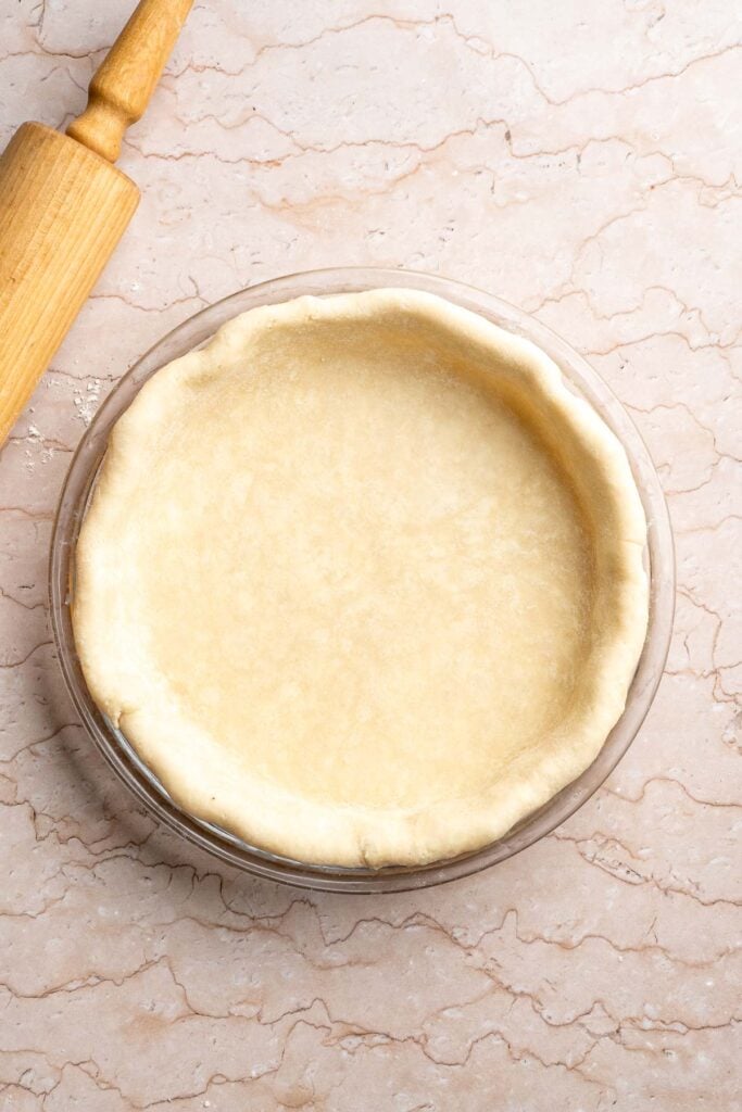 Classic Homemade Pumpkin Pie from Scratch features a buttery flaky crust and silky spiced filling - the perfect Thanksgiving dessert everyone loves. | aheadofthyme.com