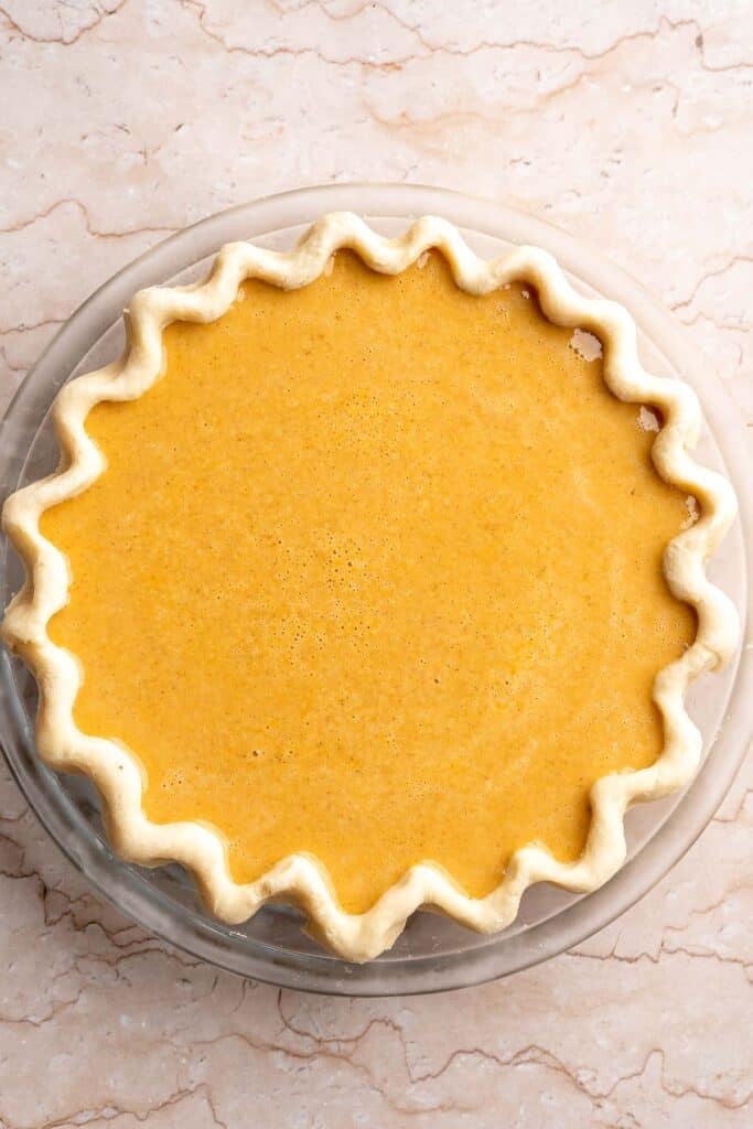 Classic Homemade Pumpkin Pie from Scratch features a buttery flaky crust and silky spiced filling - the perfect Thanksgiving dessert everyone loves. | aheadofthyme.com