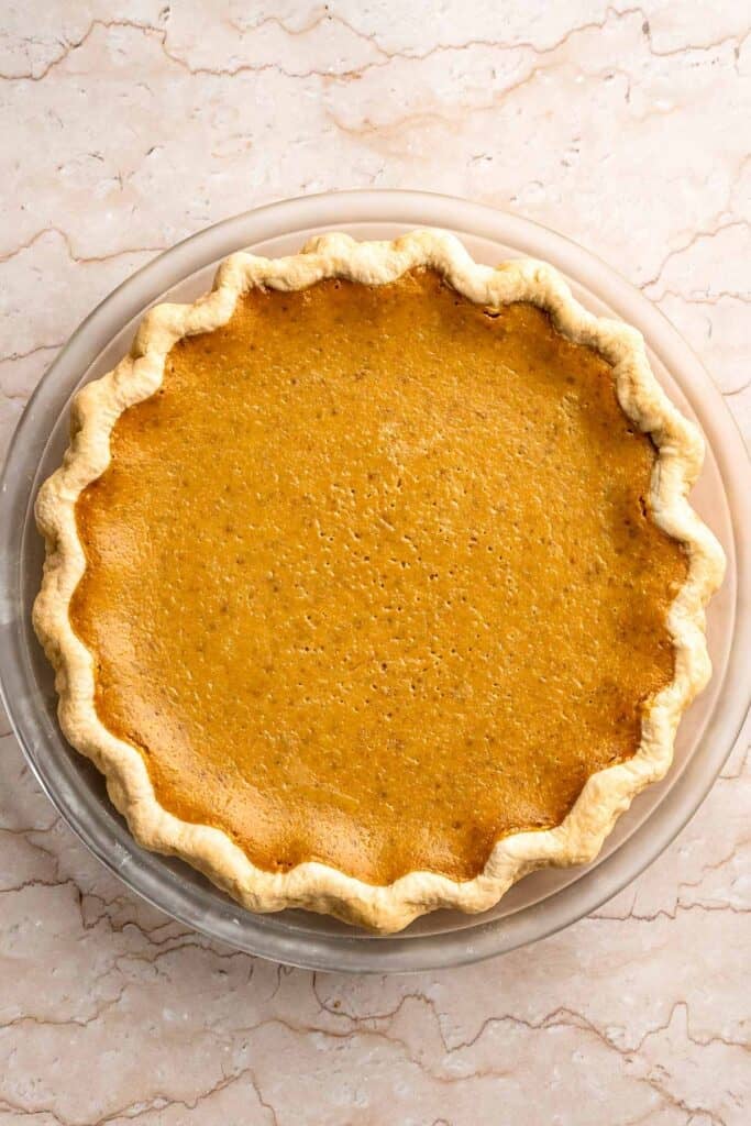 Classic Homemade Pumpkin Pie from Scratch features a buttery flaky crust and silky spiced filling - the perfect Thanksgiving dessert everyone loves. | aheadofthyme.com
