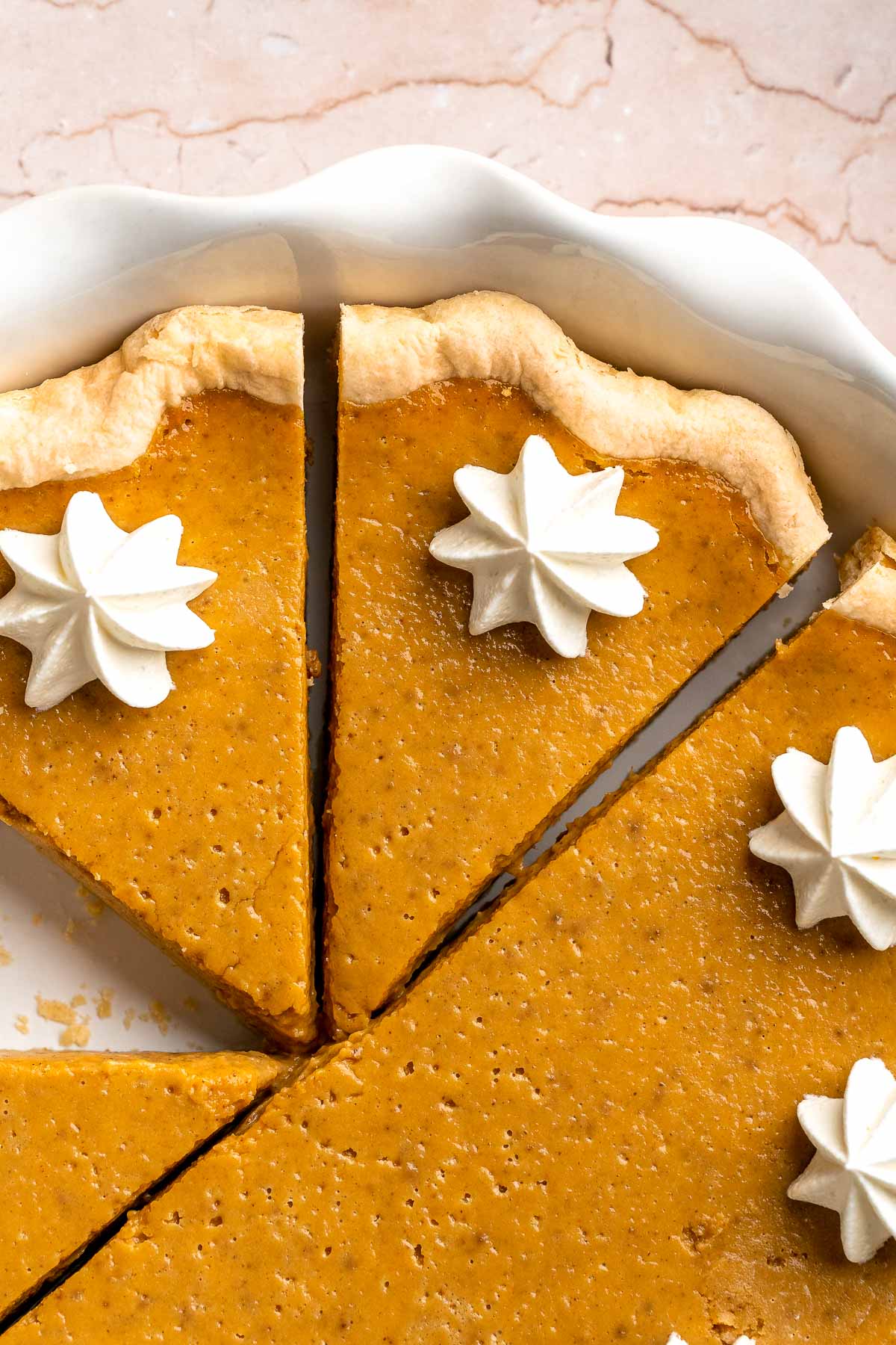 Classic Homemade Pumpkin Pie from Scratch features a buttery flaky crust and silky spiced filling - the perfect Thanksgiving dessert everyone loves. | aheadofthyme.com