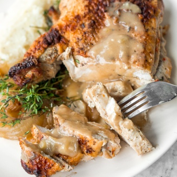 Easy juicy roasted turkey breast is the PERFECT holiday dinner, minus the headache...tender meat, crispy skin, and a layer of roasted onions. | aheadofthyme.com