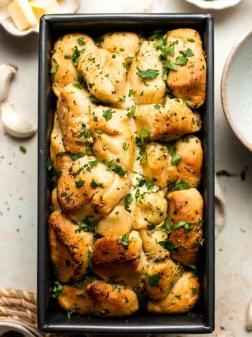 Homemade Pull Apart Garlic Bread is fluffy, buttery, flavourful, and tears easily for optimal sharing. You won't be able to stop grabbing these bites! | aheadofthyme.com