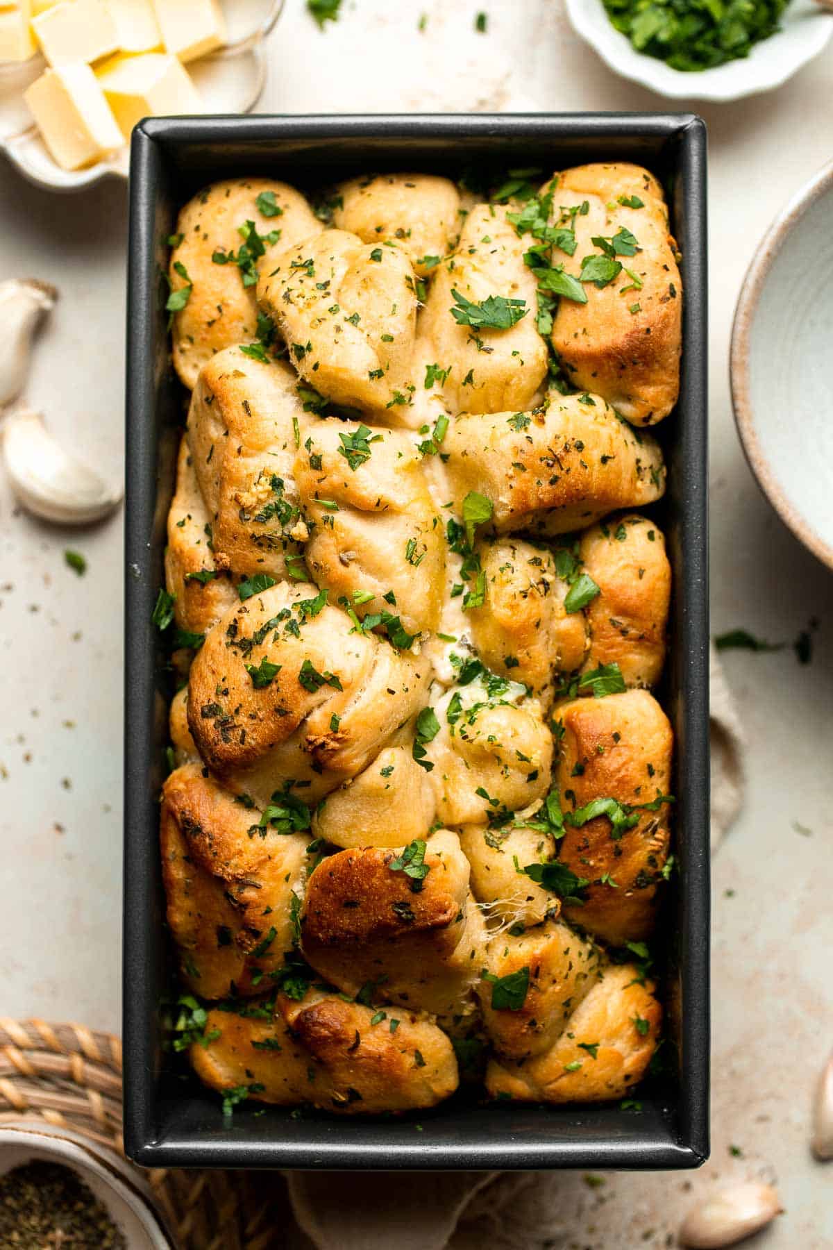 Homemade Pull Apart Garlic Bread is fluffy, buttery, flavourful, and tears easily for optimal sharing. You won't be able to stop grabbing these bites! | aheadofthyme.com