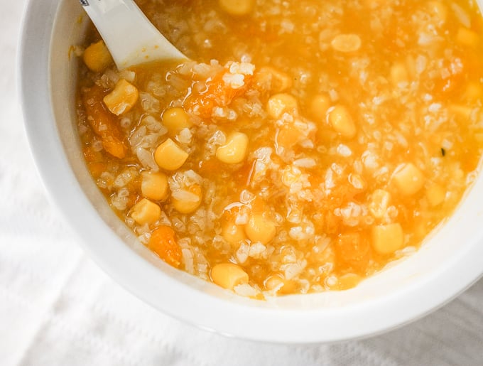 When east meets west, savoury pumpkin congee rice porridge with corn is born. It's thick and creamy -- the ultimate fall comfort food. | aheadofthyme.com