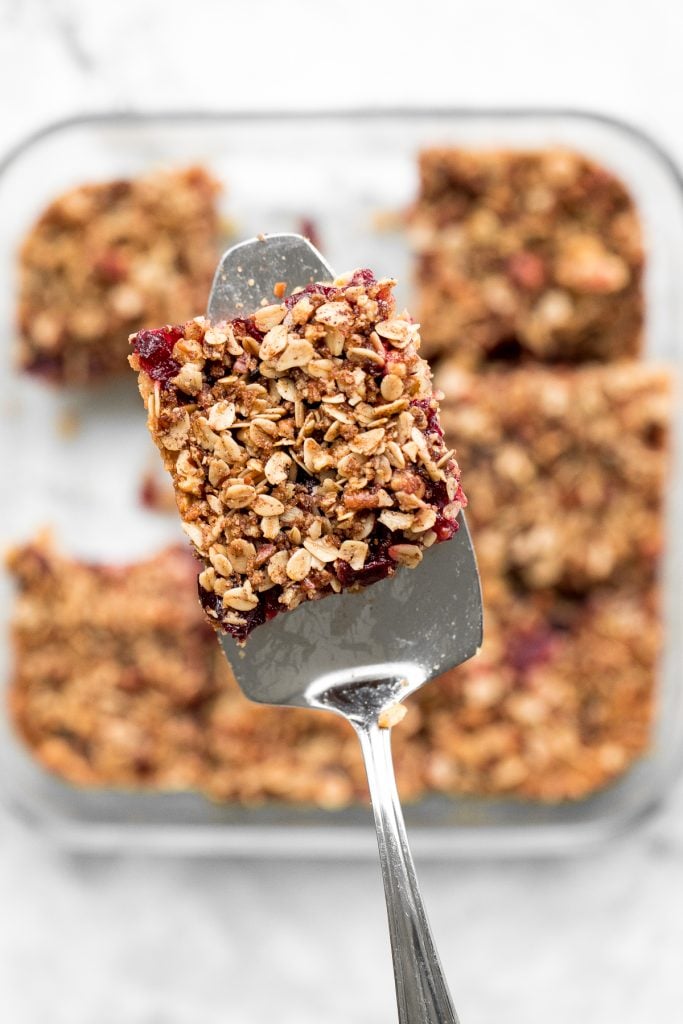 Easy cranberry sauce oat bars with a buttery crust, cranberry sauce filling, and crumbly pecan oat topping is the best way to use leftover cranberry sauce. | aheadofthyme.com